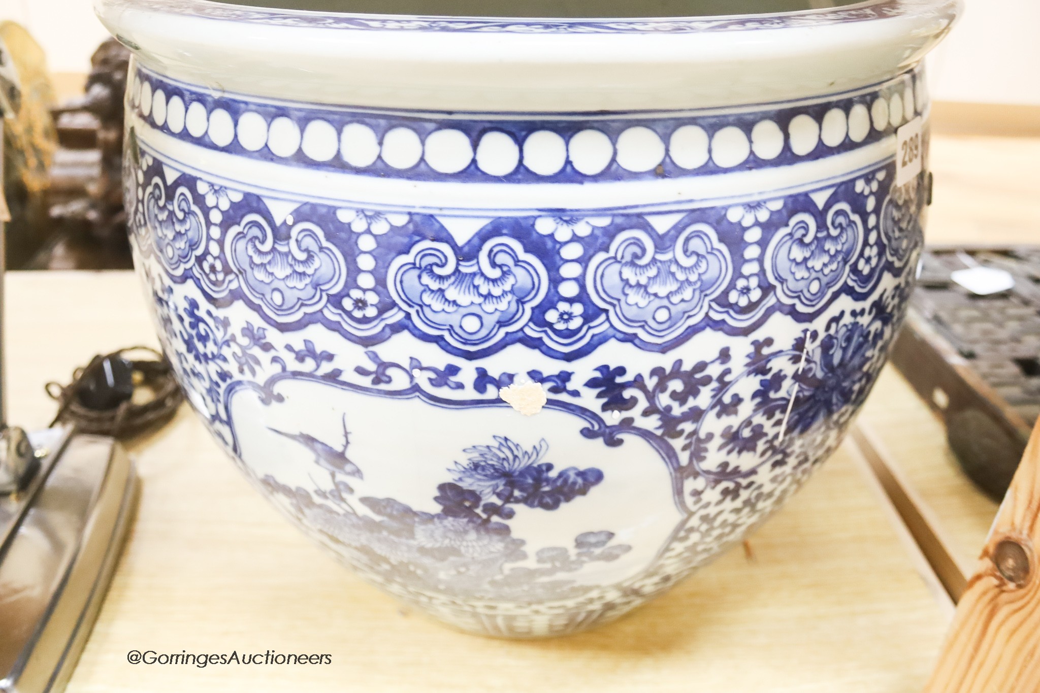 A 19th century Chinese blue and white jardiniere, height 34cm